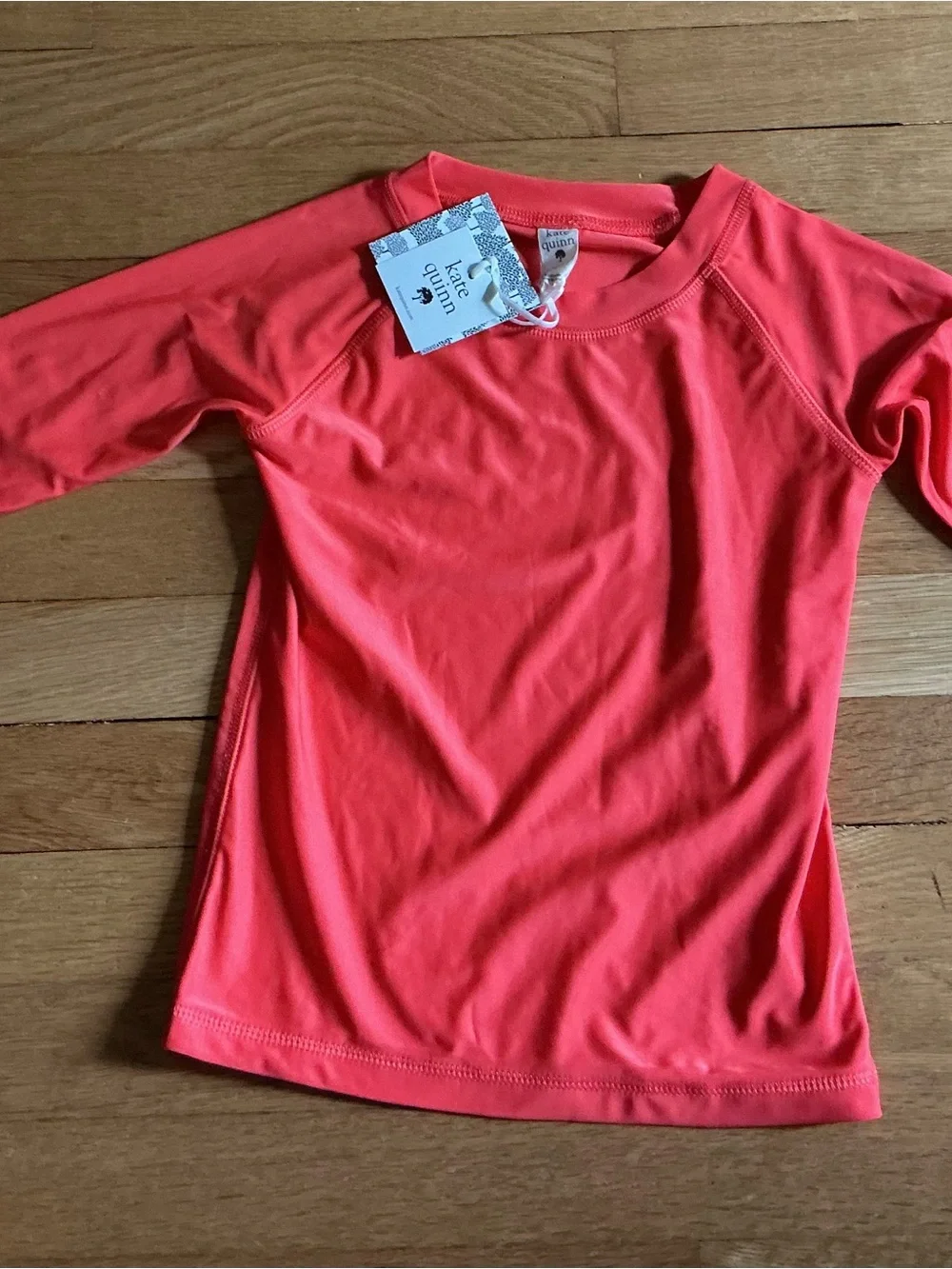 kate quinn Coral Short Sleeve Rash Guard Top